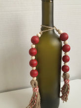 Load image into Gallery viewer, Red wood beaded bottle ornament
