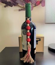 Load image into Gallery viewer, Red wood beaded bottle ornament
