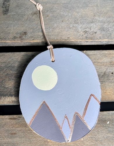 Hand painted mountain scene on birch wood slice with leather loop