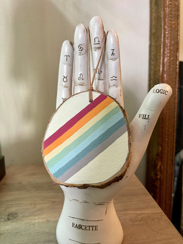 Hand painted rainbow scene on birch wood slice with leather loop