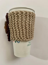 Load image into Gallery viewer, Hand knitted brown and burgundy coffee koozie with wood toggle button for decoration.
