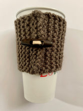 Load image into Gallery viewer, Hand knitted dark brown coffee koozie with dark brown wood toggle button for decoration.
