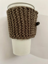 Load image into Gallery viewer, Hand knitted dark brown coffee koozie with dark brown wood toggle button for decoration.
