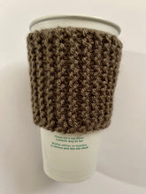 Load image into Gallery viewer, Hand knitted dark brown coffee koozie with dark brown wood toggle button for decoration.
