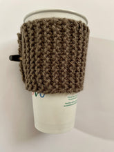 Load image into Gallery viewer, Hand knitted dark brown coffee koozie with dark brown wood toggle button for decoration.
