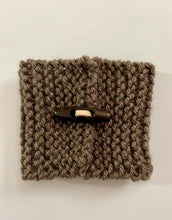 Load image into Gallery viewer, Hand knitted dark brown coffee koozie with dark brown wood toggle button for decoration.
