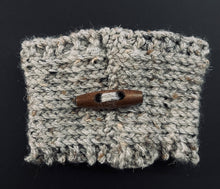 Load image into Gallery viewer, Hand knitted gray coffee koozie with wood toggle button for decoration.
