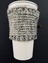 Load image into Gallery viewer, Hand knitted gray coffee koozie with wood toggle button for decoration.
