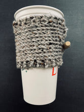 Load image into Gallery viewer, Hand knitted gray coffee koozie with wood toggle button for decoration.
