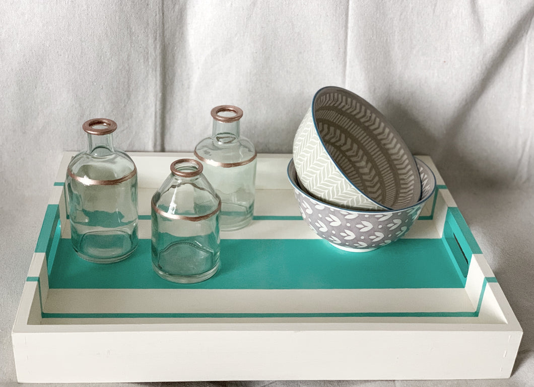 Beige hand painted wooden serving tray with turquoise stripes.