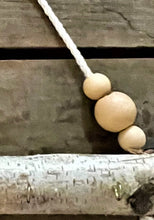 Load image into Gallery viewer, Natural birch log jewelry holder with peach beads
