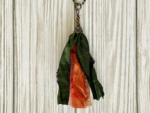 Load image into Gallery viewer, Green and orange silk tassel on antique brass ball chain
