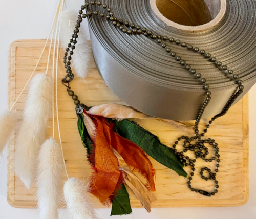 Green and orange silk tassel on antique brass ball chain
