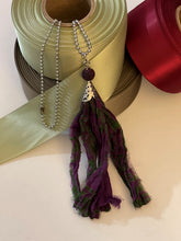 Load image into Gallery viewer, Purple and green silk tassel necklace with lava stone bead
