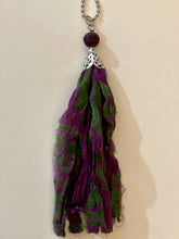 Load image into Gallery viewer, Purple and green silk tassel necklace with lava stone bead
