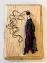 Load image into Gallery viewer, Purple and green silk tassel necklace with lava stone bead
