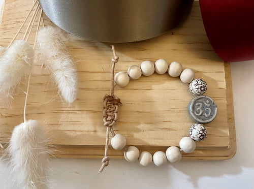Stackable natural wood bead bracelet with stone ohm sign bead on leather cord
