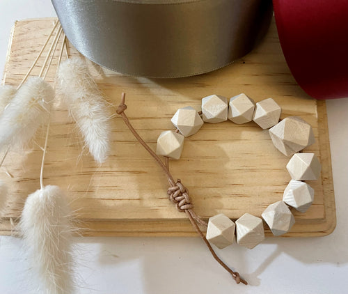 Stackable natural wood bead bracelet on leather cord