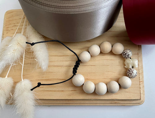 Stackable natural wood bead bracelet on black cord