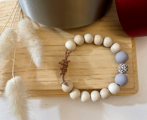 Stackable natural wood bead bracelet on leather cord