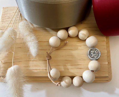 Stackable natural wood bead bracelet with stone ohm sign bead on leather cord