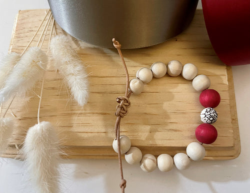 Stackable natural wood bead bracelet on leather cord