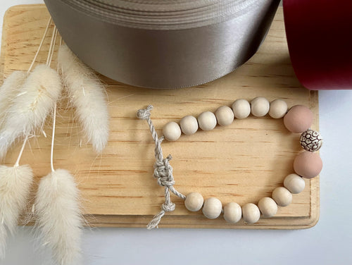 Stackable natural wood bead bracelet on hemp cord