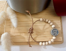 Load image into Gallery viewer, Stackable natural wood bead bracelet with stone ohm sign bead on leather cord
