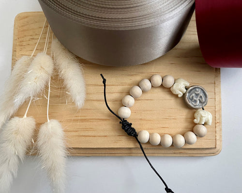 Stackable natural wood bead bracelet on black cord