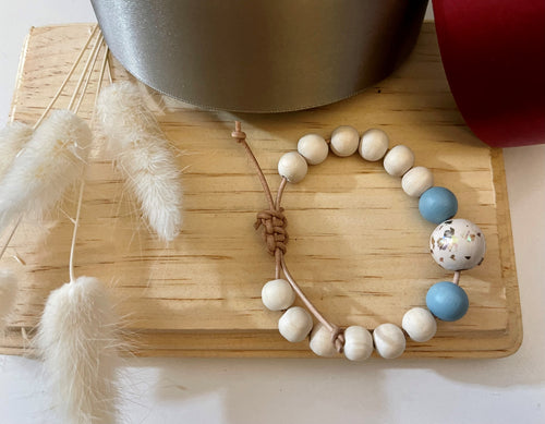 Stackable natural wood bead bracelet on leather cord