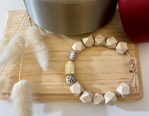 Stackable natural wood bead bracelet on leather cord