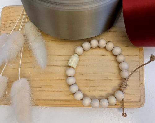Stackable natural wood bead bracelet on leather cord