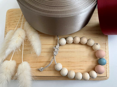 Stackable natural wood bead bracelet on hemp cord