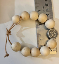 Load image into Gallery viewer, Stackable natural wood bead bracelet with stone ohm sign bead on leather cord
