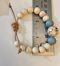 Load image into Gallery viewer, Stackable natural wood bead bracelet on leather cord
