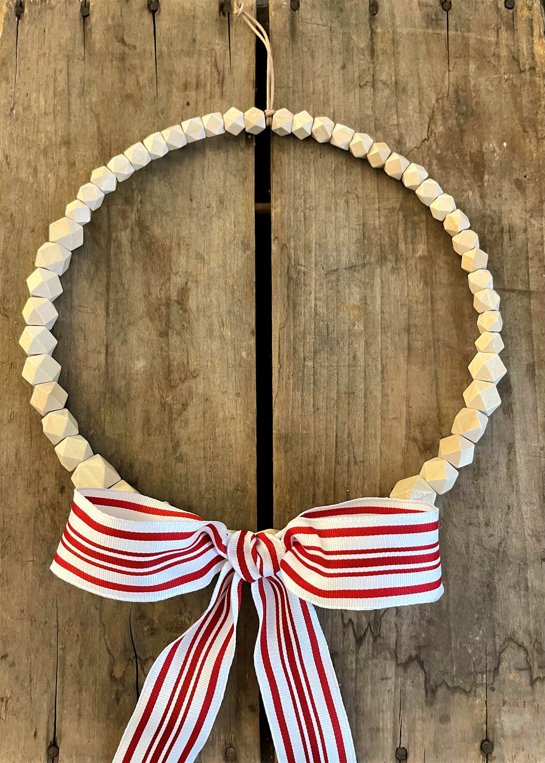 Wood Bead Wreath with Large Red and White Bow